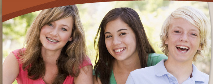 group of kids smiling and wearing braces