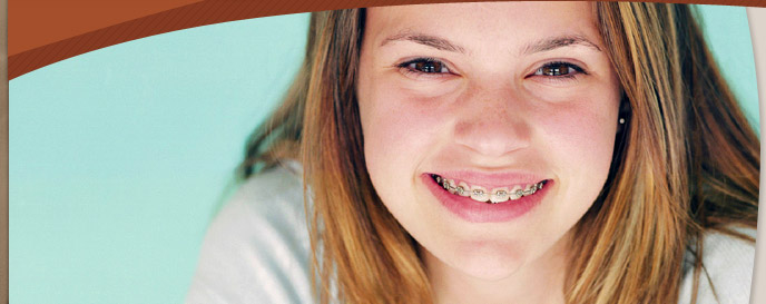 teen girl smiling and wearing braces